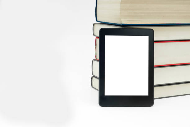 istock E-book device with books in white isolated background 851927074