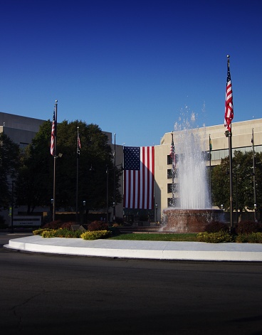 Concrete court building with American Flags and fountain