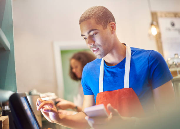 Coffee Shop Worker With Digital Order Screen Stock Photo - Download Image Now - Teenager, Occupation, Part-Time Job - iStock