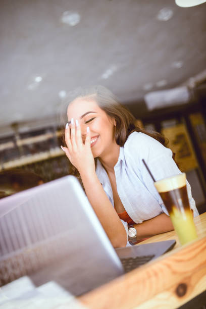 istock Laughing Female Freelancer Working in her Favorite Cafe in Morning 851934086