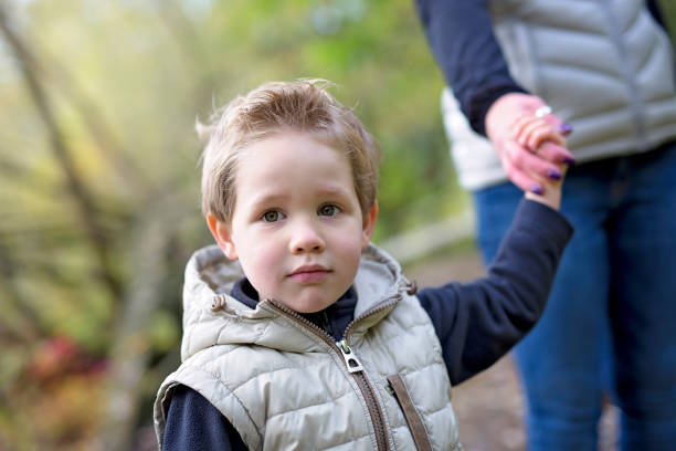 istock boy in autumn season in a park 851939826
