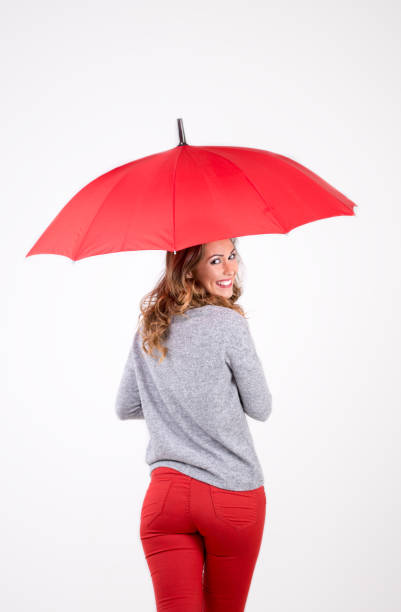 istock Beautiful woman with red umbrella 851940326