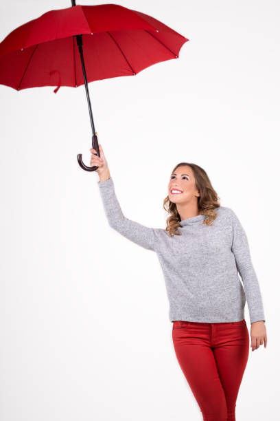 istock Beautiful woman with red umbrella 851940460