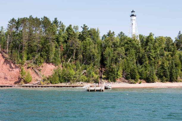 White lighthouse on an Apostle Island in Lake Superior Apostle Islands in Lake Superior near Bayfield, Wisconsin bayfield county stock pictures, royalty-free photos & images