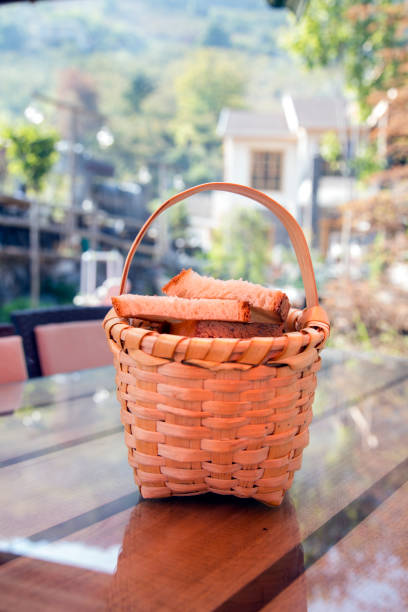 istock Close up view of fresh crusty bread in a basket. Bread 851946956