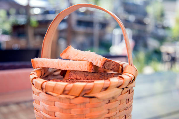 istock Close up view of fresh crusty bread in a basket. Bread 851946958