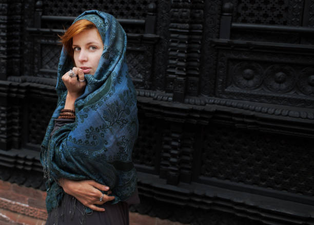 istock young woman in scarf 851948798