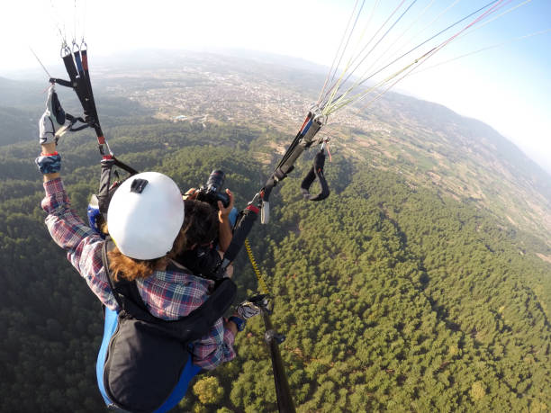 istock Adventure photographers flying with paragliding 851953780