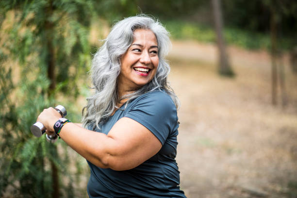 senior mexican woman working out - women sweat healthy lifestyle exercising imagens e fotografias de stock