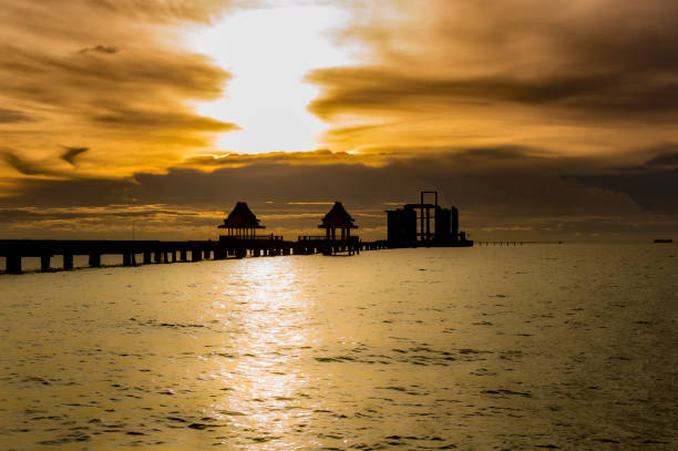 istock Silhouette The long bridge over the sea with a beautiful sunrise. 851968726