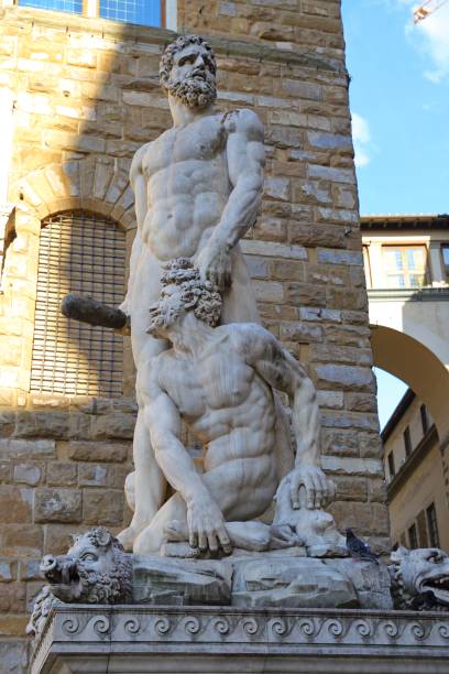 Hercules and Cacus Statue by Bandinelli Hercules and Cacus Statue by Bandinelli at Piazza della Signoria in Florence, Italy hercules florence italy muscular build statue stock pictures, royalty-free photos & images
