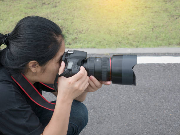 istock Photographer on green background 851973250