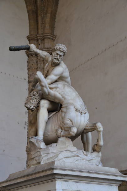 Statue of Hercules killing the Nesso Centaur Statue of Hercules killing the Nesso Centaur in Piazza della Signoria in Florence Italy. hercules florence italy muscular build statue stock pictures, royalty-free photos & images