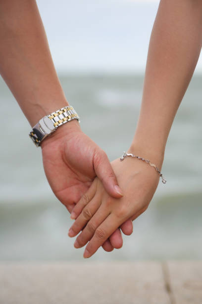 istock Couple holding hands at Beach 851976512