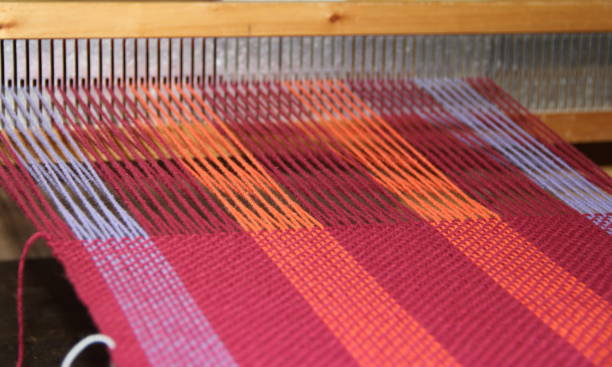 istock colorful knitted garments and blankets, comb loom, yarns 851983496