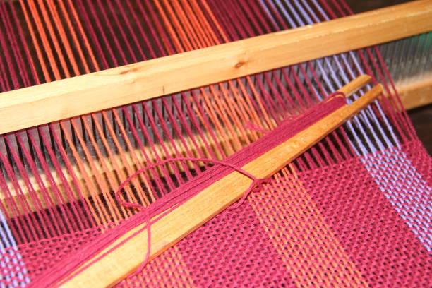 istock colorful knitted garments and blankets, comb loom, yarns 851983502