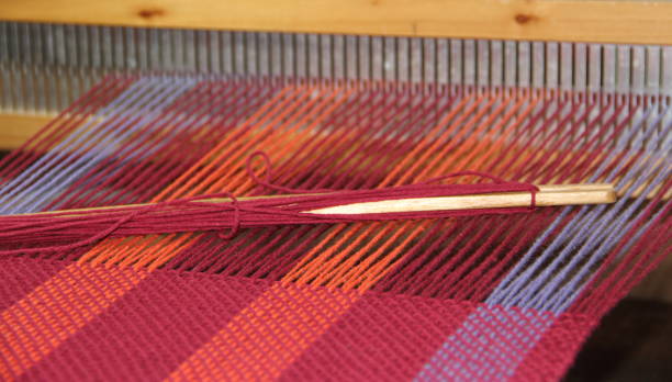 istock colorful knitted garments and blankets, comb loom, yarns 851983632