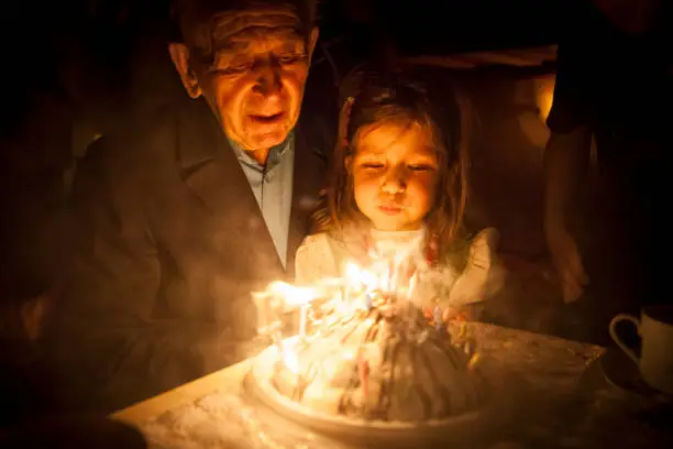 Birthday party for Great grandfather with cake and candle