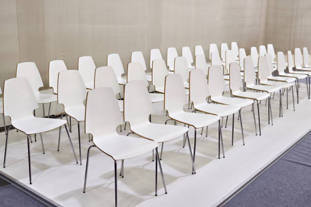 istock Rows of white chairs in presentation room 851994164