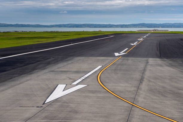 Markings to indicate that a runway is ahead at the end of a taxiway, Dulles International Airport, Dulles, Virginia, United States.