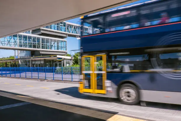 Photo of Blurred moving bus at park and ride transport station on North Shore, New Zealand, NZ