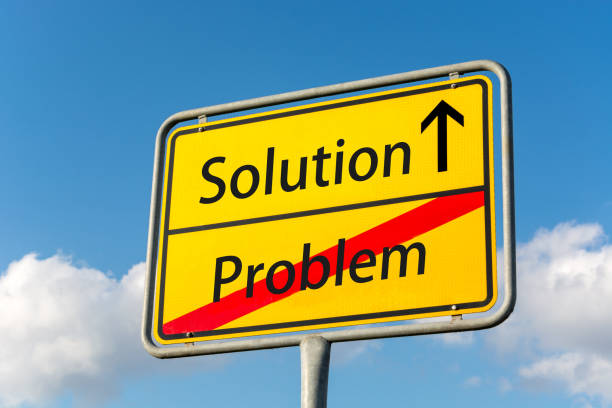 istock Yellow street sign with a solution ahead leaving problem behind close up 851998250