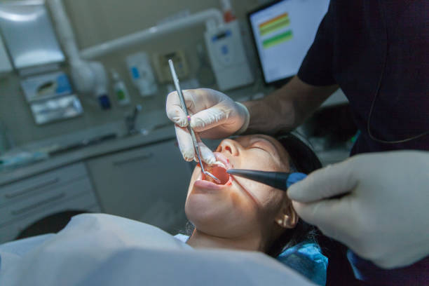 Oral surgery Female patient having teeth implant operation tooth extraction stock pictures, royalty-free photos & images