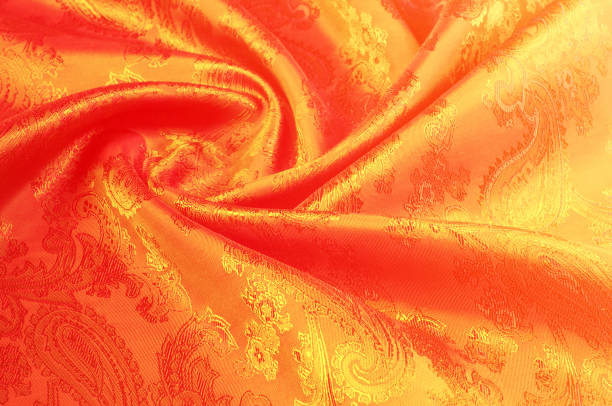 istock Fabric silk texture gold color, red and yellow pattern 851998706