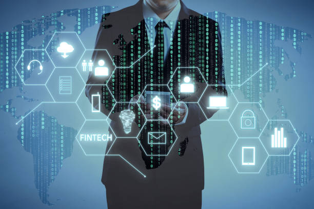 istock Businessman with fintech icon and internet of things with matrix code background, Investment and financial internet technology concept. 852000250