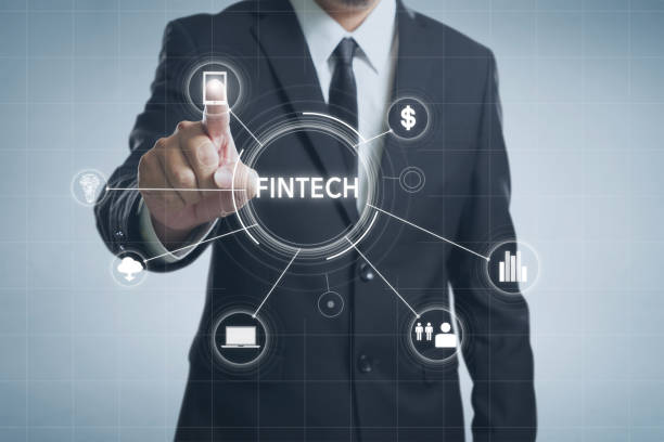 istock Businessman with fintech icon and internet of things with matrix code background, Investment and financial internet technology concept. 852000620