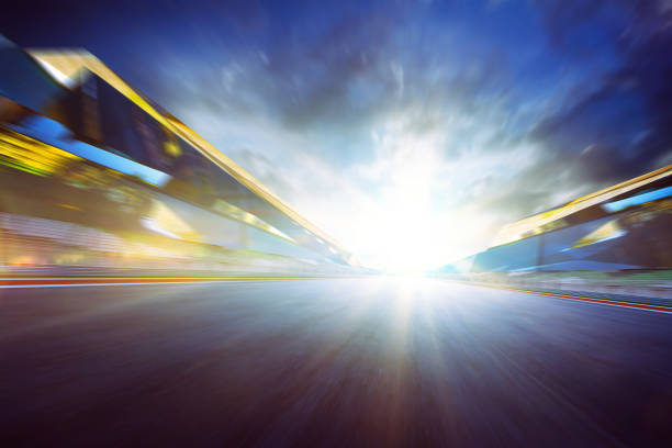 istock View of the infinity empty asphalt international race track, digital imaging recomposition montage background . evening scene . 852000646