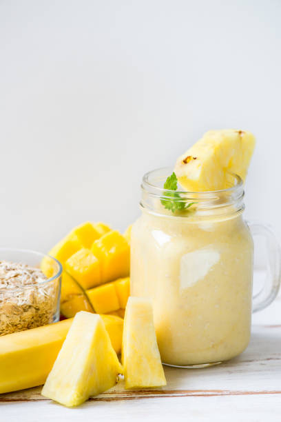 istock Mango, Banana, Pineapple and Oatmeal Smoothie in the Jar 852002722