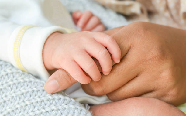 istock Baby hand holding mother's hand. 852003868