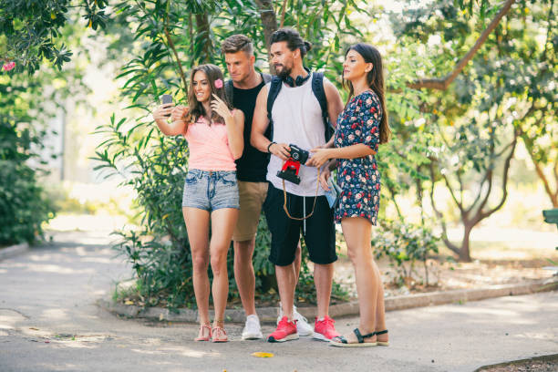 istock Group of friends laughing and having fun in the park 852004408
