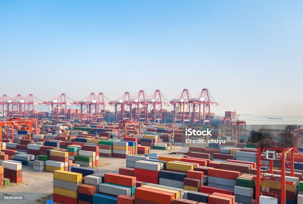 modern container terminal at dusk shipping container terminal at dusk,  modern harbor and global trade background Harbor Stock Photo