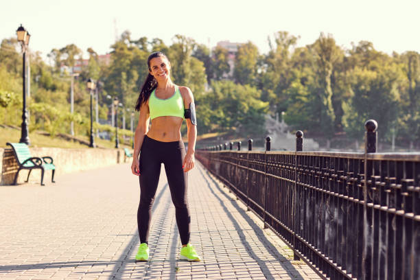 istock A brunette woman is an athlete runner in the park. 852010580
