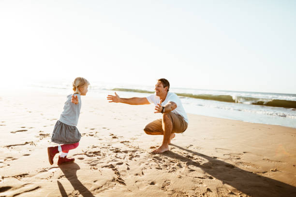 istock little daughter running to the father 852011458