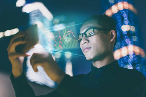 istock Businessman using futuristic mobile phone 852015202