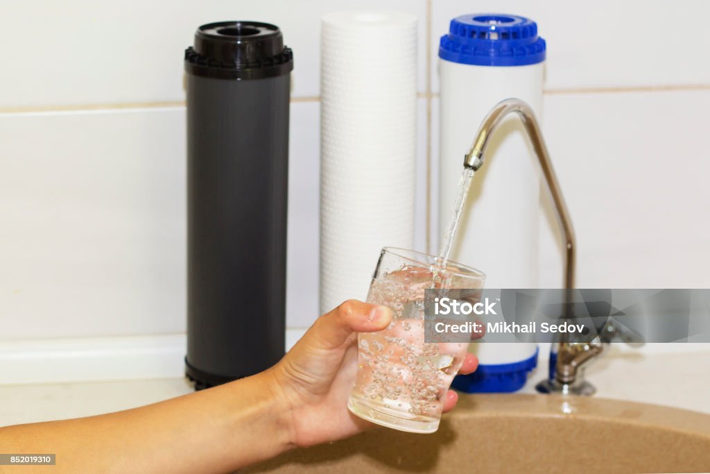 Great filters to purify your drinking water an image isolated in the kitchen interior Great filters to purify your drinking water an image isolated in the kitchen interior. Water Filter Jug Stock Photo