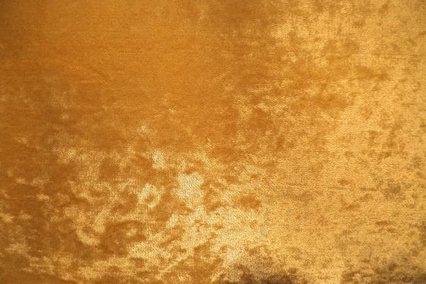 istock Gold colour velvet fabric background texture 852027482
