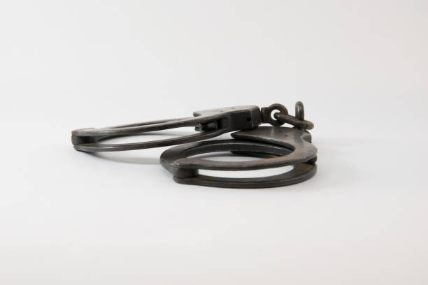 istock Old Police handcuffs isolated on white background 852032008