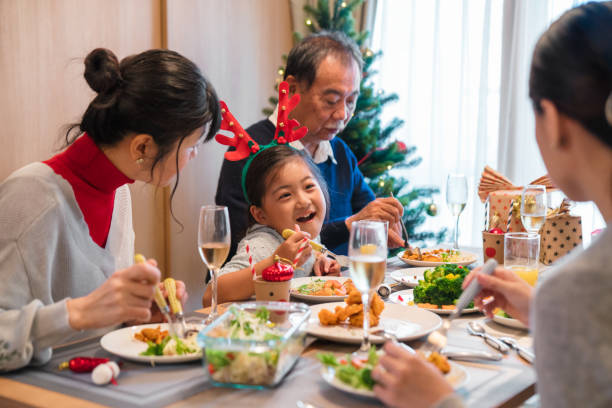 istock Multi-generation family eating Christmas dinner together 852032010
