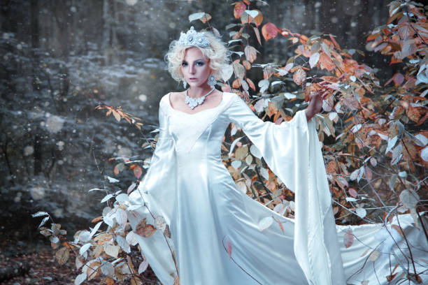 istock Fairytale Snow Queen portrait bringing winter in autumn forest. 852036856