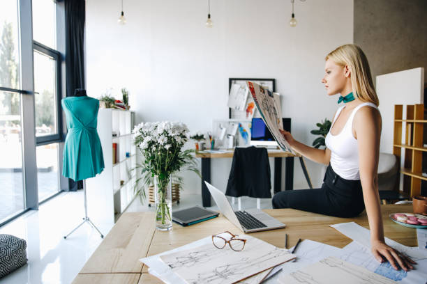 istock young fashion designer with sketches 852036870