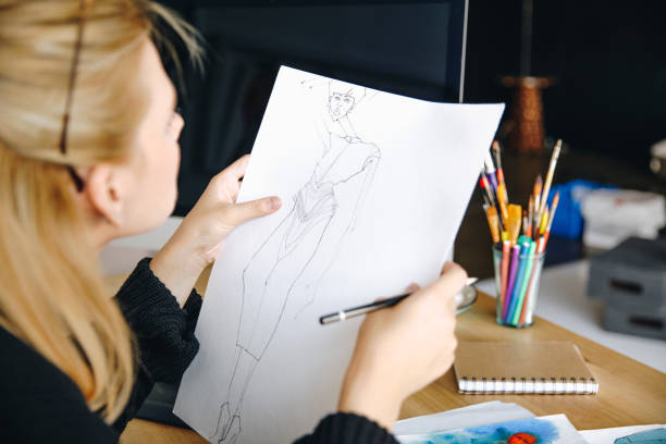 istock fashion designer drawing sketch 852037174