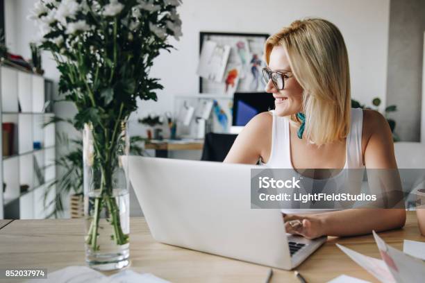 Fashion Designer Using Laptop Stock Photo - Download Image Now - Fashionable, Laptop, Women