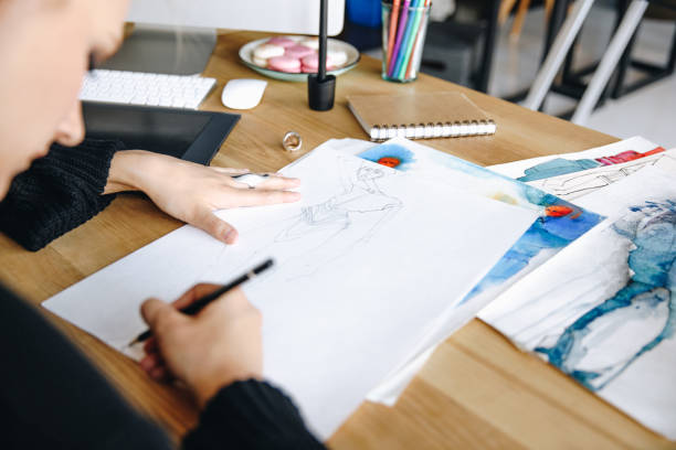 istock fashion designer drawing sketch 852039072