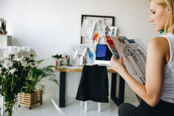 istock young fashion designer with sketches 852039252