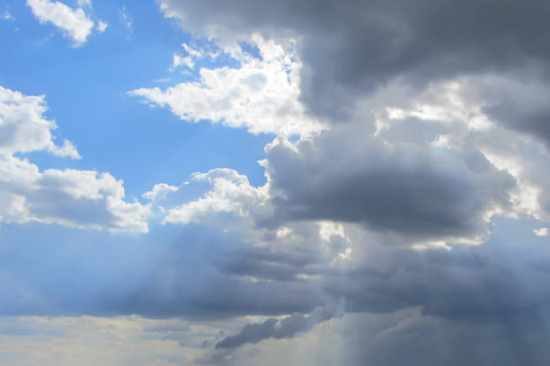 istock Sunshine from the dark clouds in the blue sky 852042914