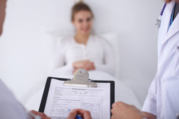 istock A group of doctors discussing medical history close up 852044886